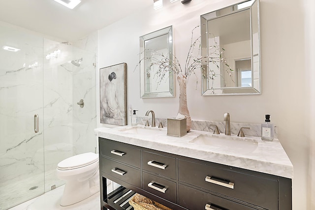 bathroom featuring a sink, a marble finish shower, toilet, and marble finish floor