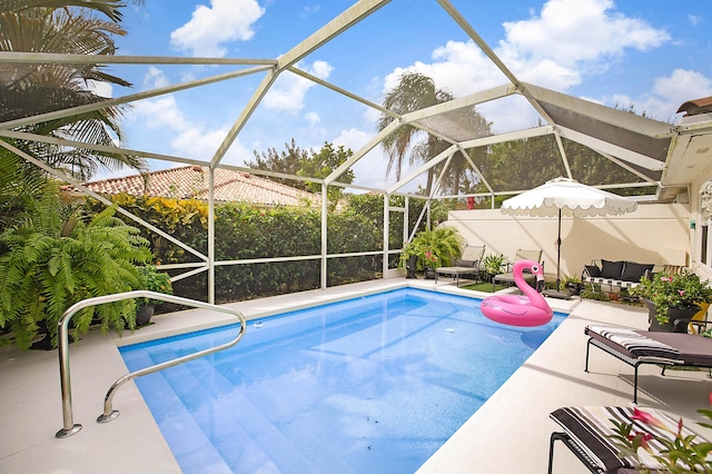 pool featuring an outdoor living space, a patio, and a lanai