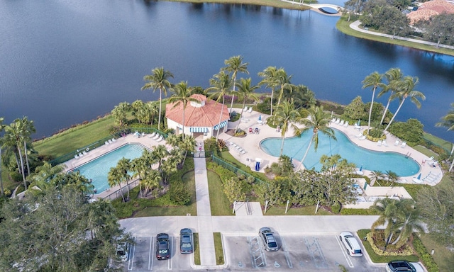 birds eye view of property featuring a water view