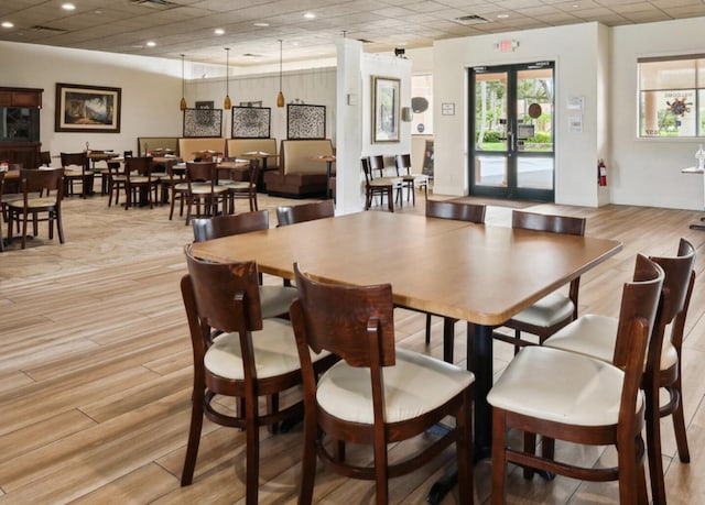 dining room with recessed lighting, a drop ceiling, visible vents, and light wood-style floors