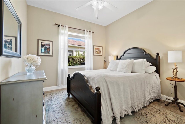 bedroom featuring baseboards and ceiling fan