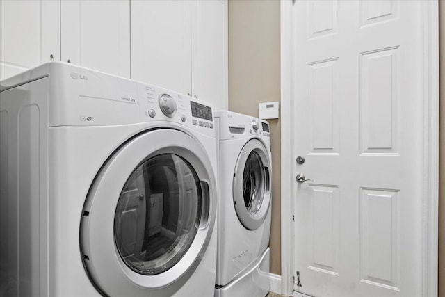 washroom featuring washer and clothes dryer