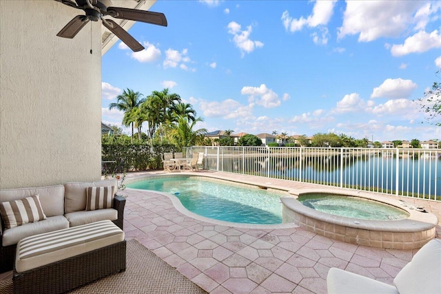 view of swimming pool with an outdoor living space, a water view, a patio, and fence