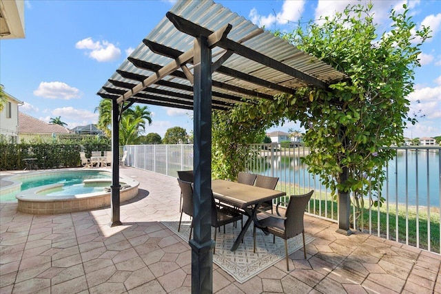 view of patio featuring a pool with connected hot tub, fence, a pergola, and a water view