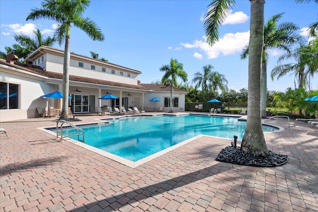 community pool featuring a patio and a ceiling fan