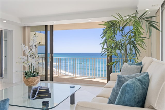 living room with recessed lighting and a water view