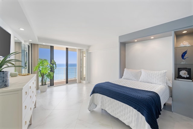 bedroom with access to exterior, a water view, a wall of windows, recessed lighting, and marble finish floor