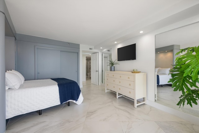 bedroom with visible vents, recessed lighting, marble finish floor, and a closet