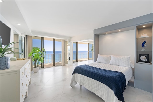 bedroom with a water view, marble finish floor, floor to ceiling windows, recessed lighting, and access to exterior