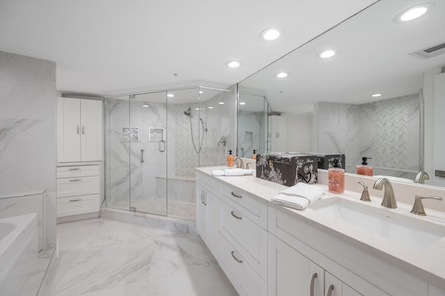 bathroom featuring a marble finish shower, visible vents, recessed lighting, marble finish floor, and a sink