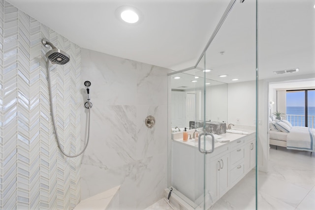 full bathroom featuring a marble finish shower, visible vents, ensuite bathroom, marble finish floor, and a sink