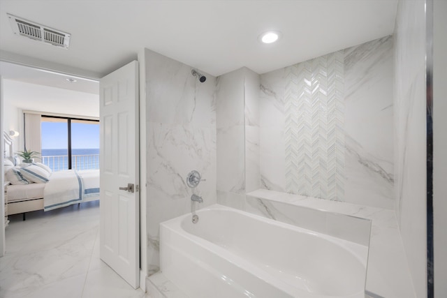 ensuite bathroom featuring visible vents, a water view, marble finish floor, ensuite bath, and shower / washtub combination