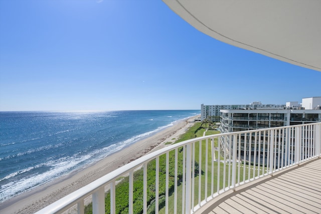 balcony with a beach view and a water view