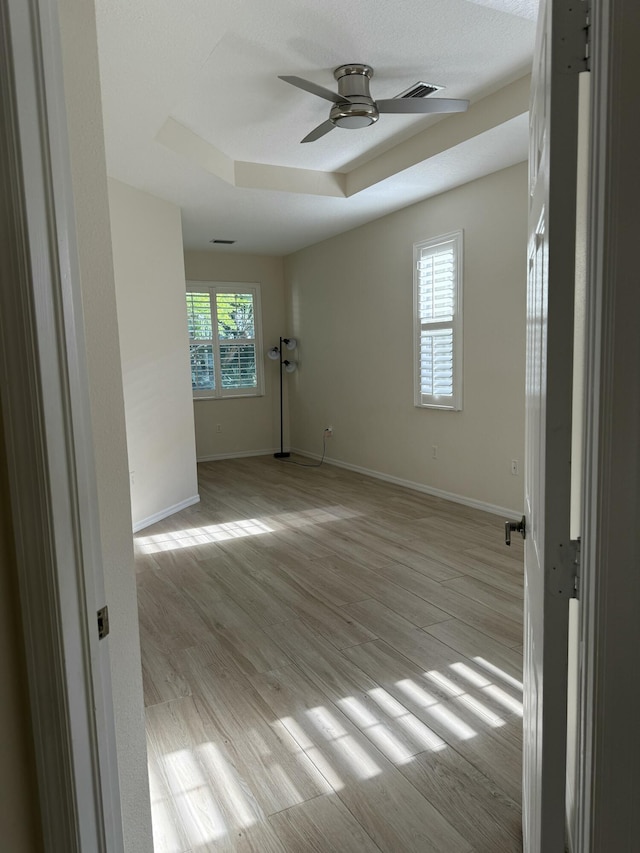 560 SW Indian Key Dr S, Saint Lucie West, FL 34986 - empty room featuring baseboards, light wood-type flooring, and a ceiling fan