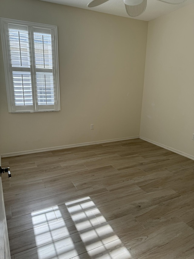560 SW Indian Key Dr S, Saint Lucie West, FL 34986 - spare room with wood finished floors, a ceiling fan, and baseboards