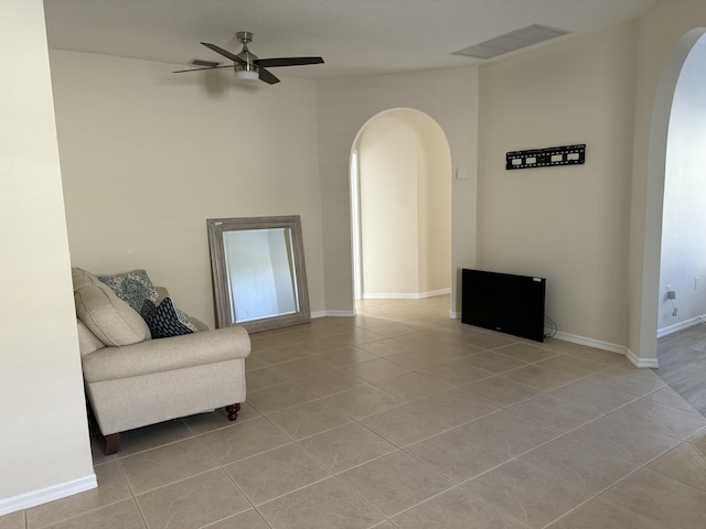 560 SW Indian Key Dr S, Saint Lucie West, FL 34986 - sitting room featuring light tile patterned floors, visible vents, baseboards, arched walkways, and a ceiling fan