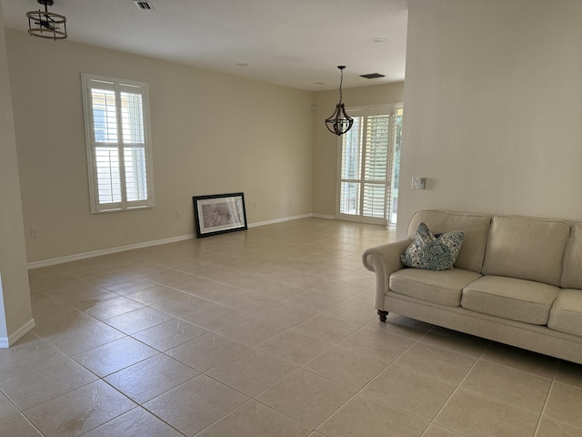 560 SW Indian Key Dr S, Saint Lucie West, FL 34986 - living area featuring light tile patterned floors, visible vents, and baseboards