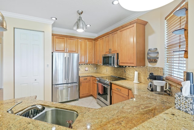 kitchen featuring light stone counters, light tile patterned flooring, a sink, ornamental molding, and stainless steel appliances