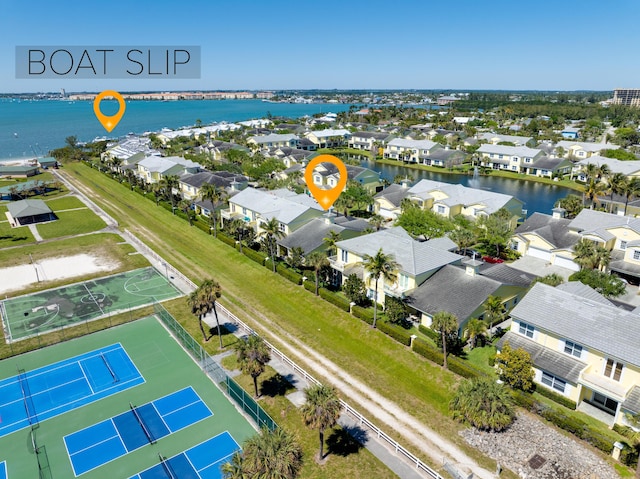 bird's eye view featuring a residential view and a water view