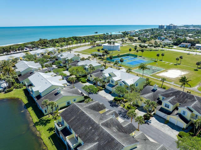 birds eye view of property with a water view and a residential view