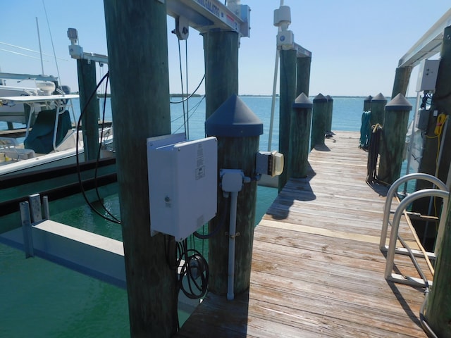 view of dock featuring a water view and boat lift