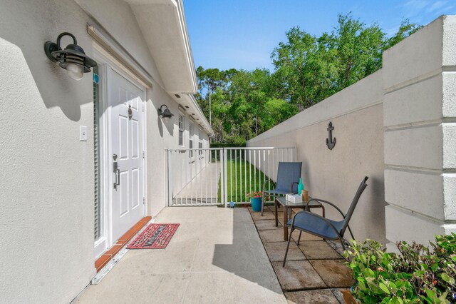 2853 White Trout Ln, West Palm Beach, FL 33411 - view of patio / terrace with a gate