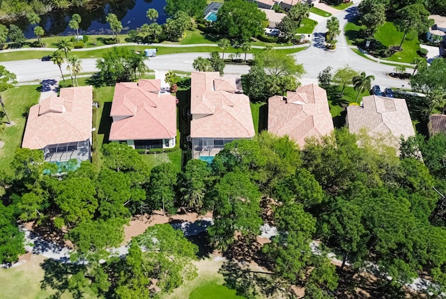 bird's eye view featuring a residential view and a water view