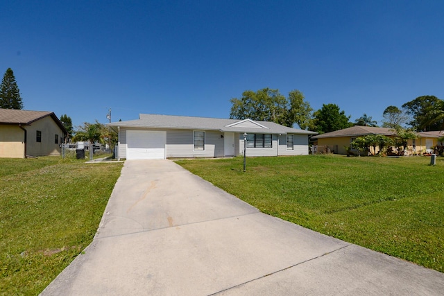 ranch-style home with an attached garage, concrete driveway, and a front lawn