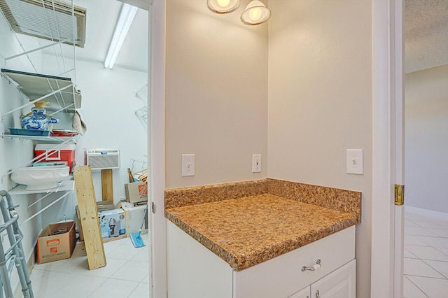 bathroom with tile patterned floors