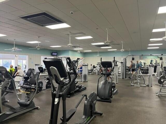 406 Flanders I, Delray Beach, FL 33484 - gym featuring a ceiling fan
