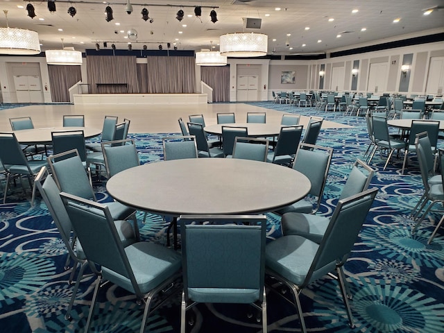 dining area featuring rail lighting and recessed lighting