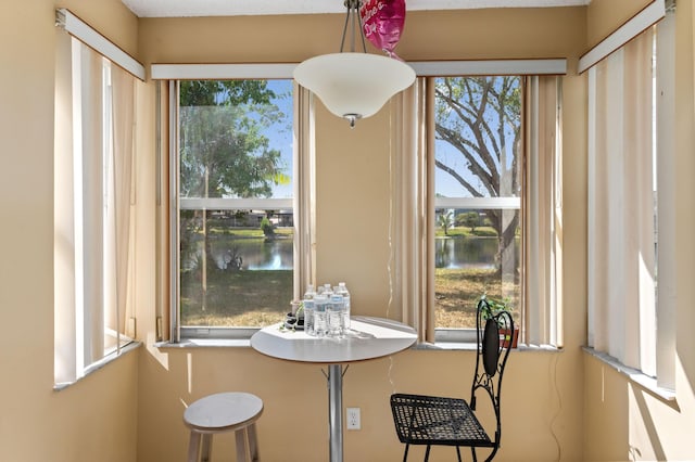 dining space with a water view