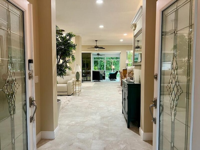 hallway featuring recessed lighting and baseboards