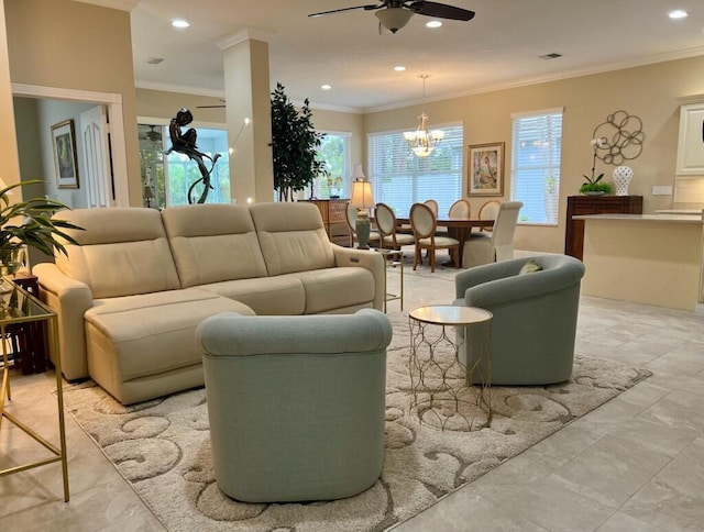 living room featuring recessed lighting, ceiling fan with notable chandelier, and crown molding