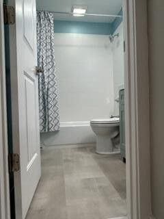 bathroom with toilet and walk in shower