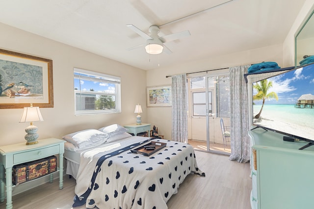 bedroom with light wood-type flooring, ceiling fan, and access to outside