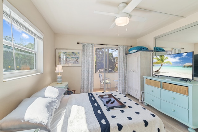 bedroom with light wood-type flooring and a ceiling fan