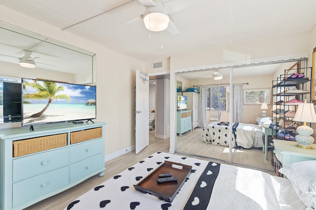 bedroom with baseboards, visible vents, and light wood-type flooring