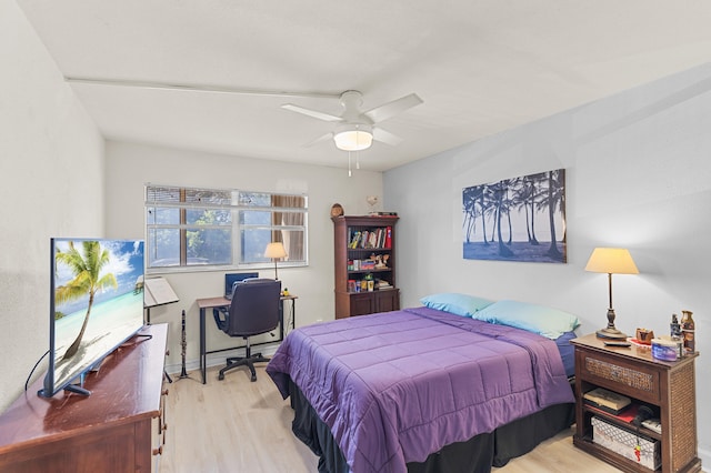 bedroom with a ceiling fan and wood finished floors