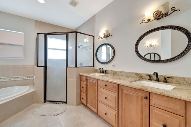 full bathroom featuring visible vents, a sink, tile patterned flooring, and a stall shower