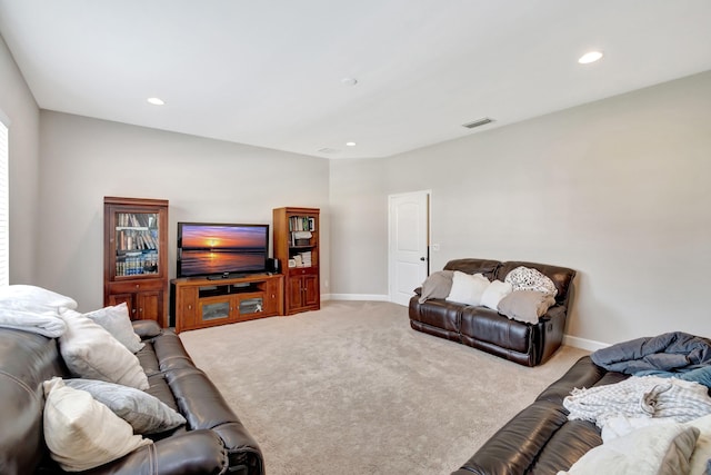 carpeted living room with visible vents, recessed lighting, and baseboards