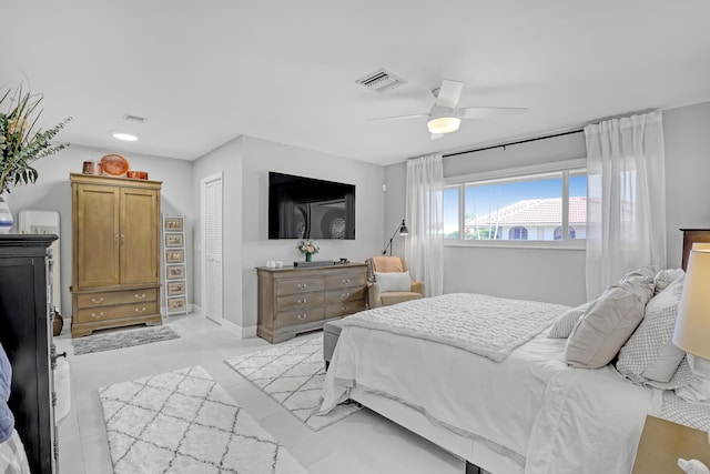 bedroom with visible vents, baseboards, a closet, and ceiling fan