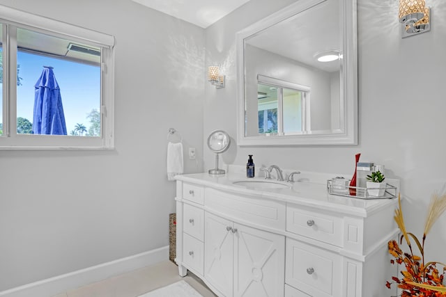 bathroom featuring baseboards and vanity