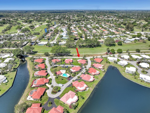 drone / aerial view with a water view and a residential view