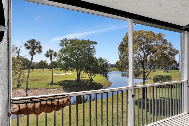 balcony featuring a water view
