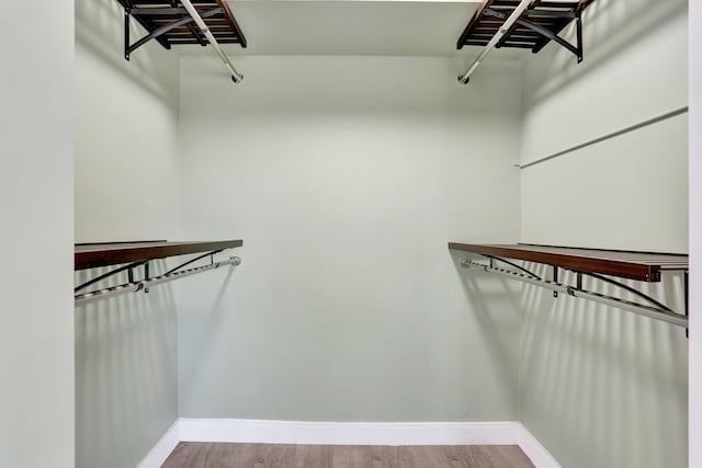 spacious closet with wood finished floors