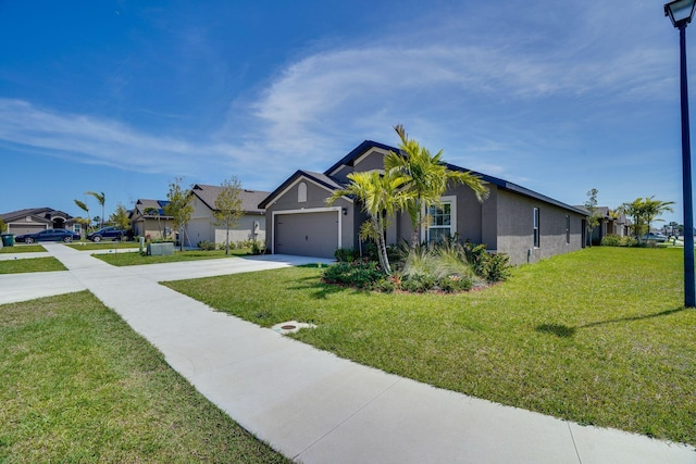 view of front of home featuring a front lawn, a residential view, stucco siding, a garage, and driveway