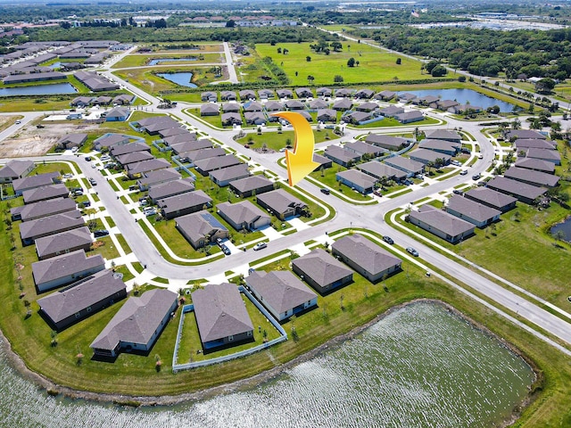 aerial view featuring a residential view and a water view