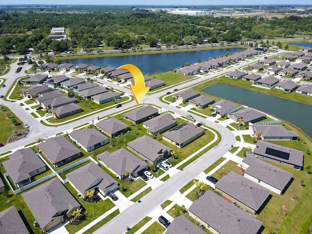 aerial view with a residential view and a water view