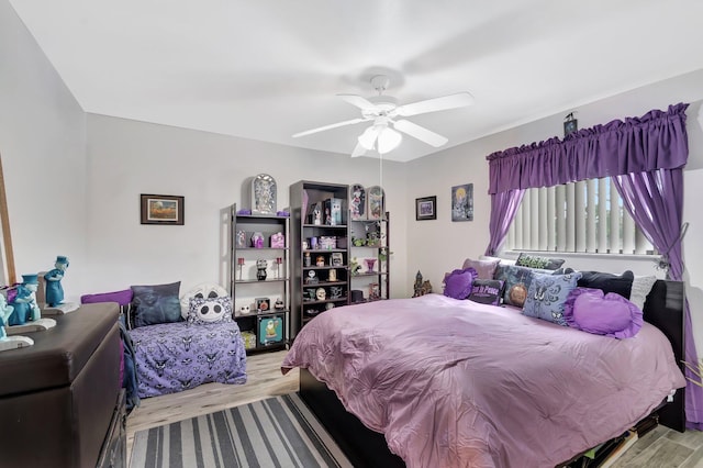 bedroom with ceiling fan and wood finished floors